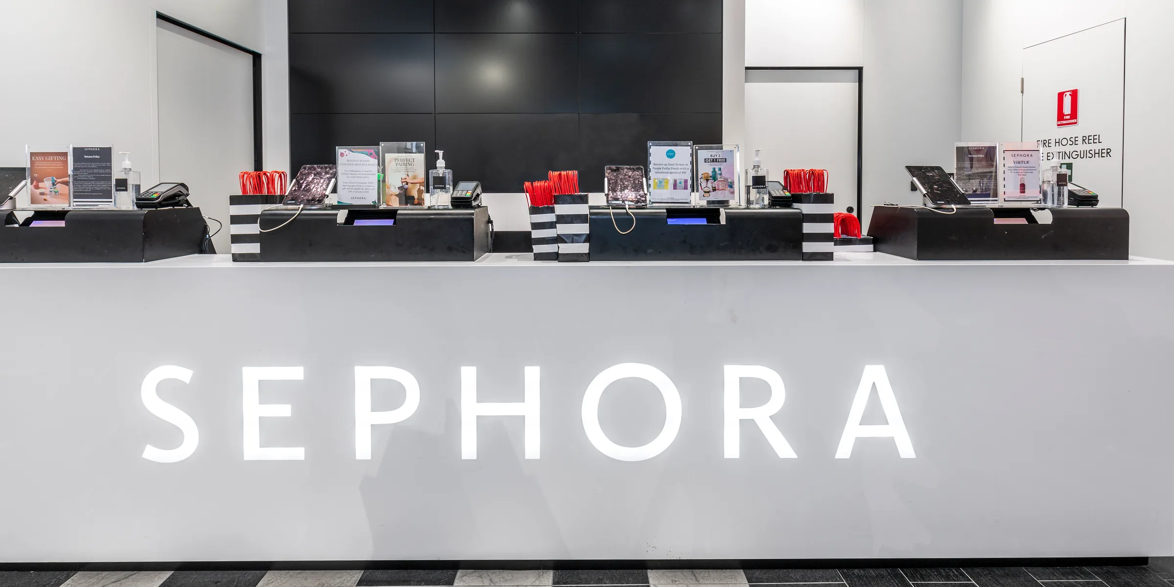 Sephora – Pitt St flagship — service counter with the SEPHORA wordmark, joinery by VBP Interiors