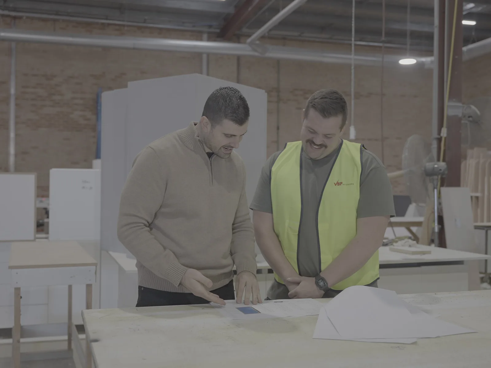 VBP Interiors team reviewing plans at the workbench in the Condell Park workshop